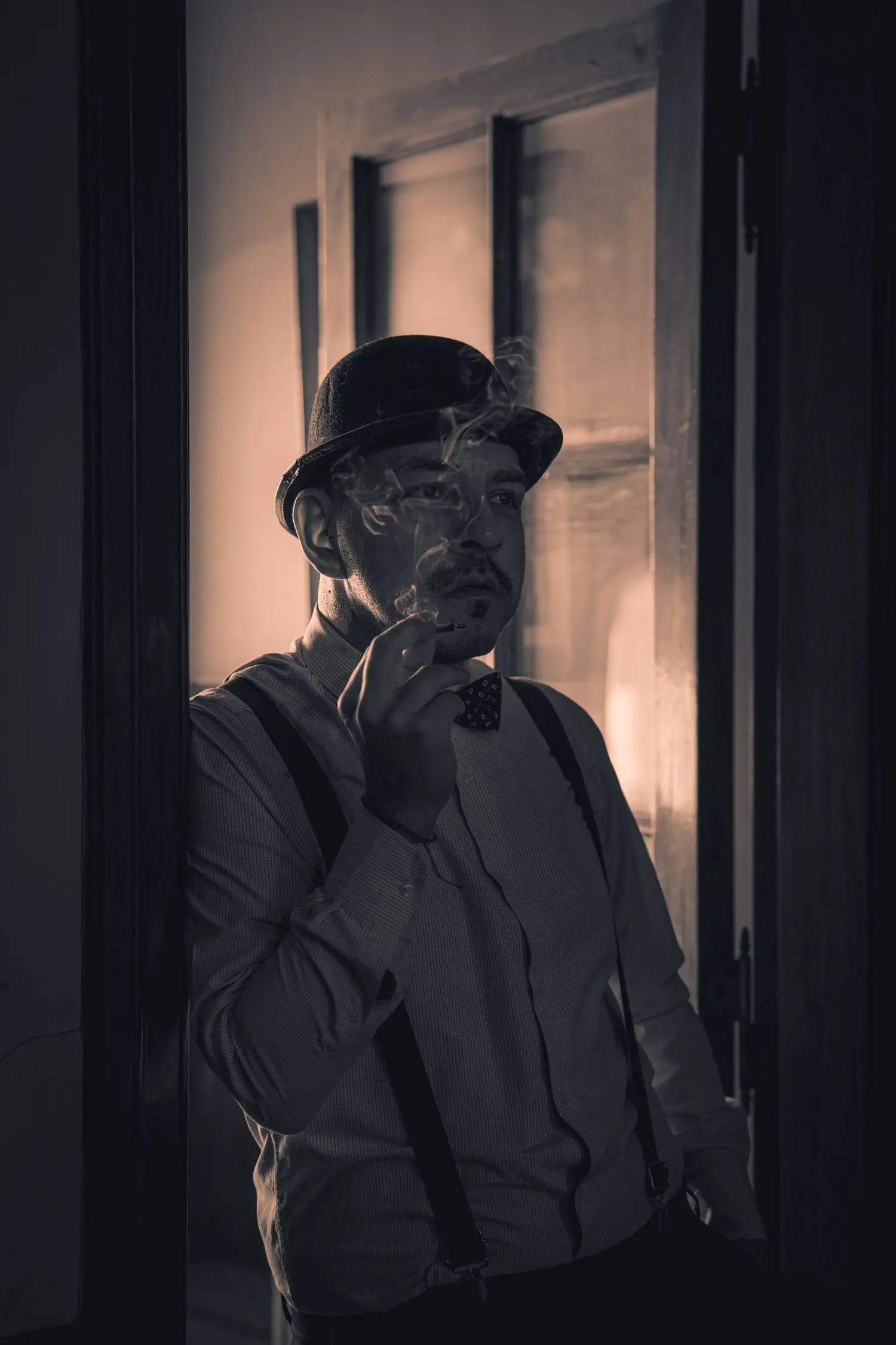 Noir silhouette suggesting a guarded screen character