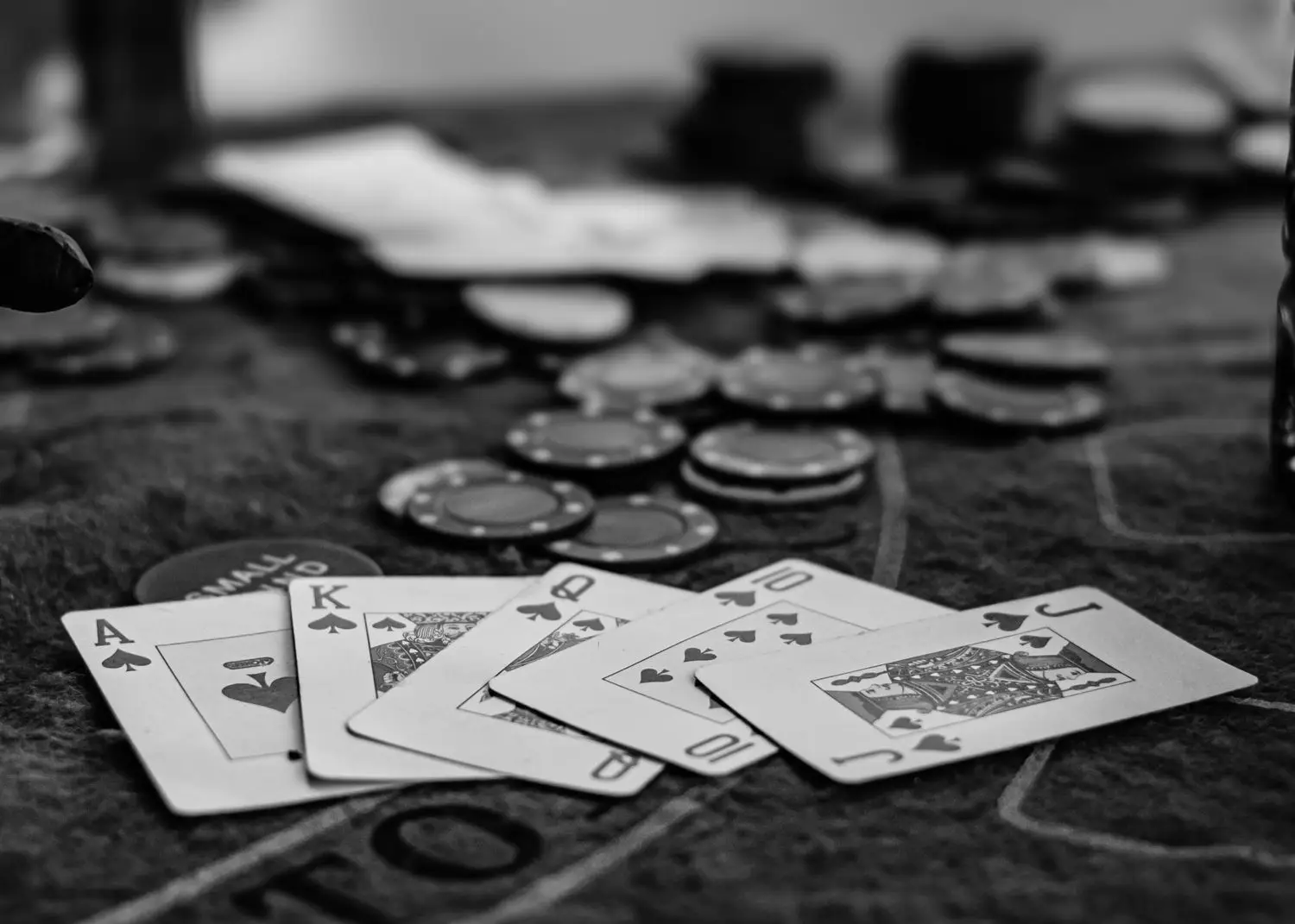 Cards and chips arranged on green felt