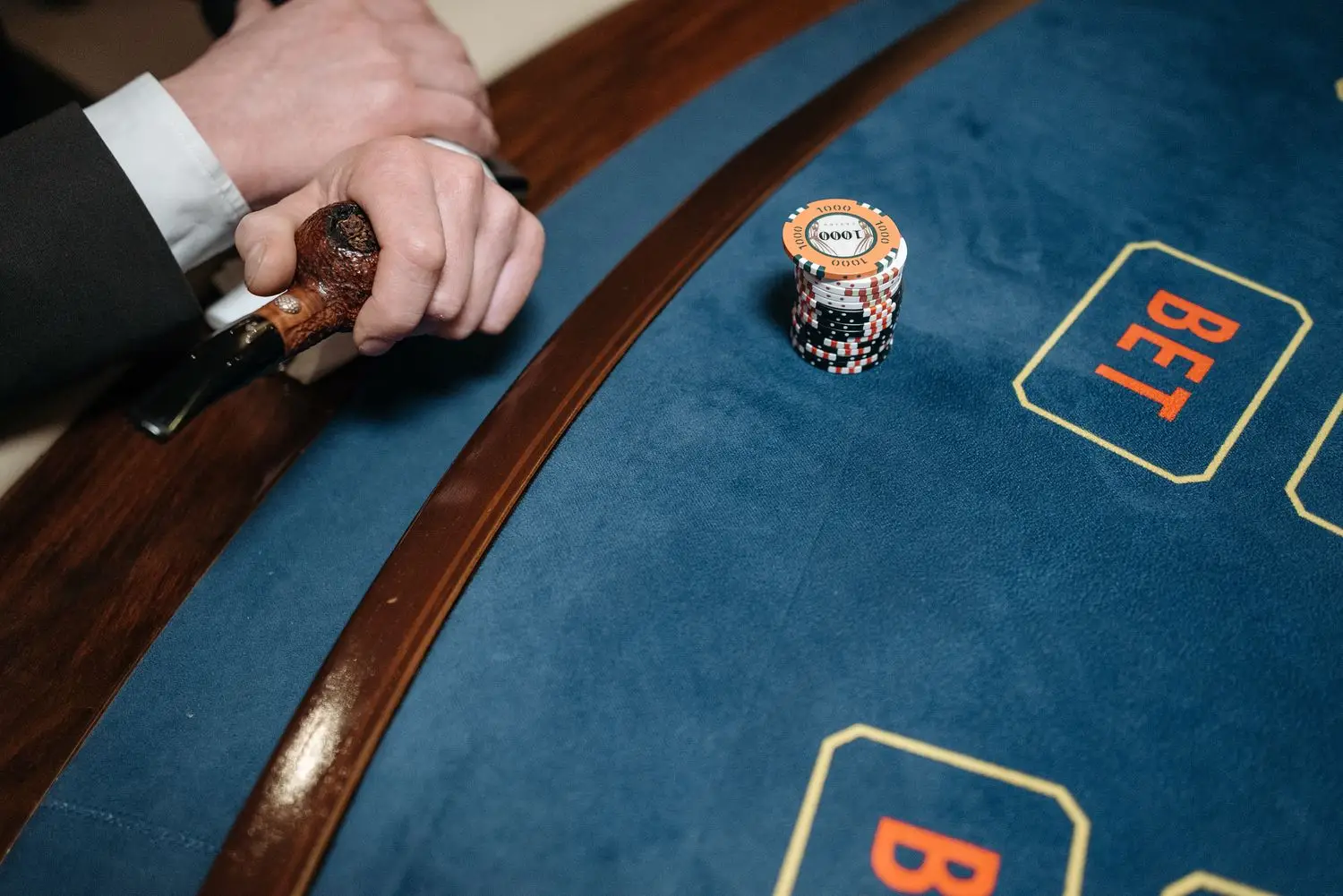 Card table photographed from above with clustered chips