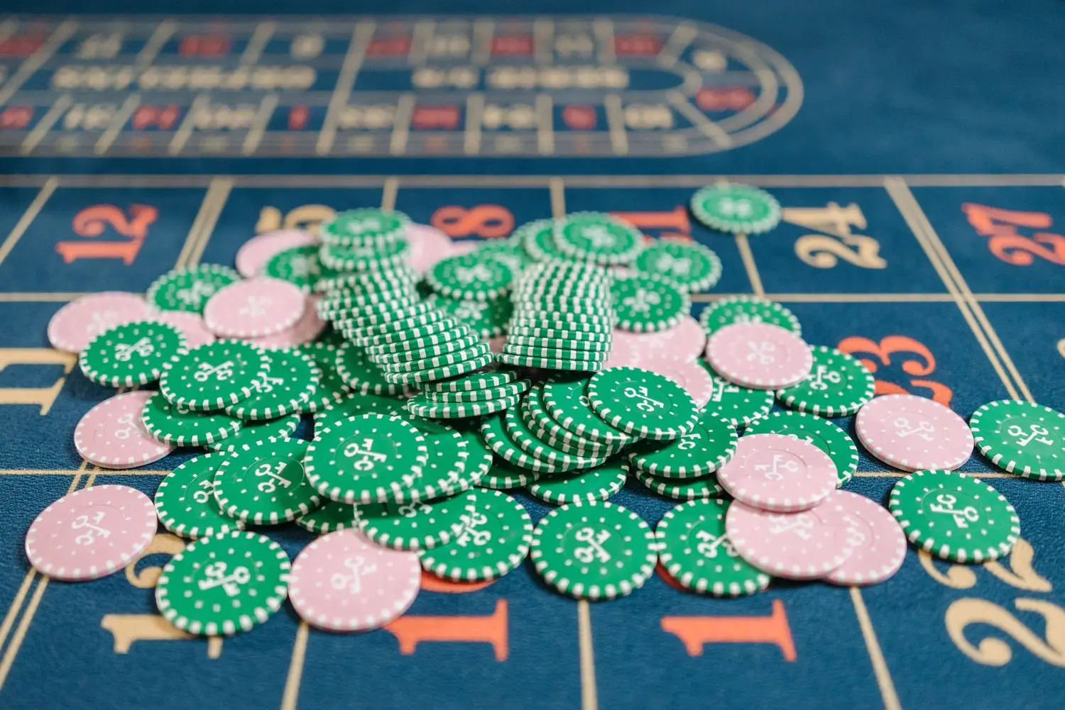Green card table with dramatic overhead lighting